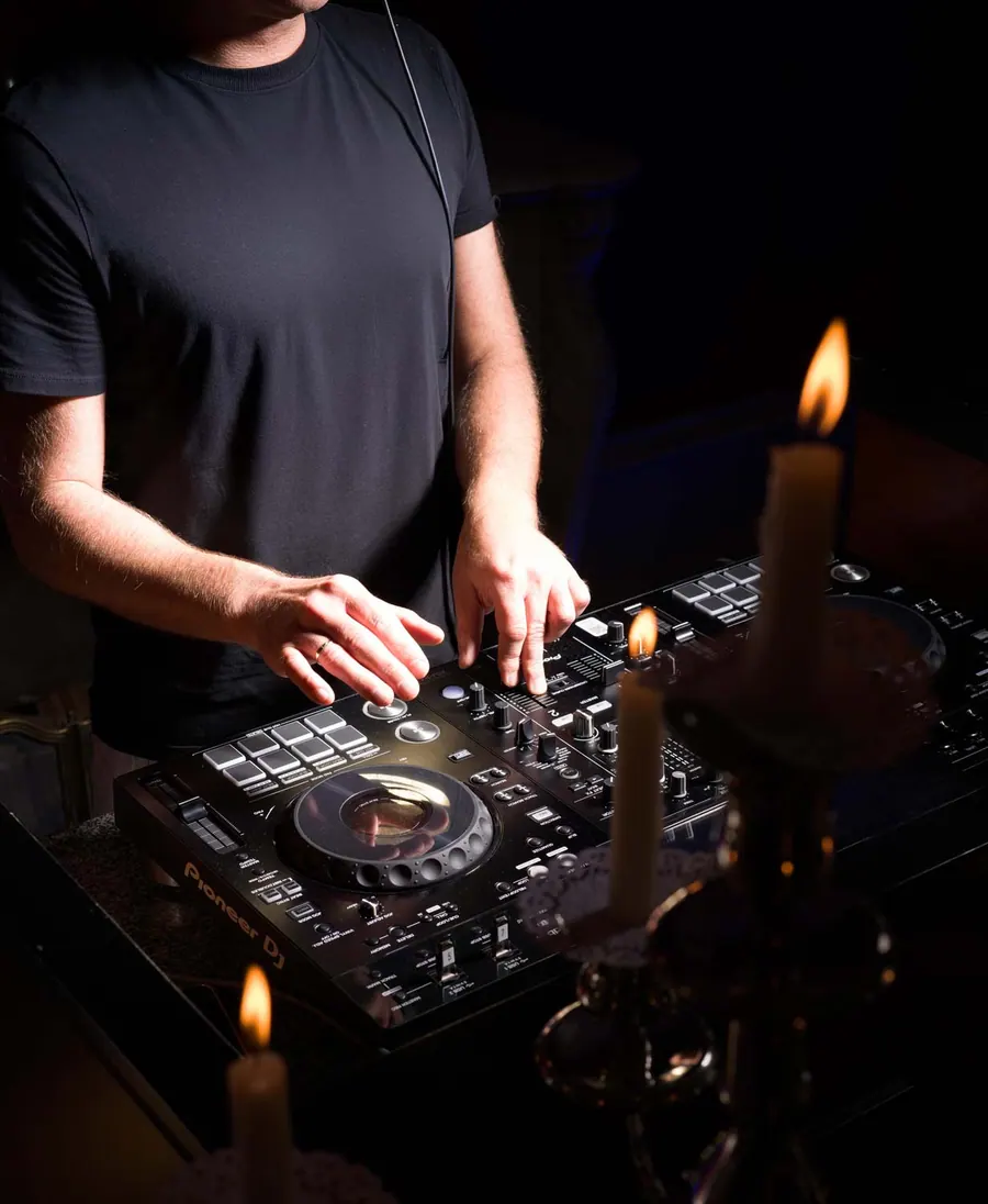 The DJ at the decks by candlelight
