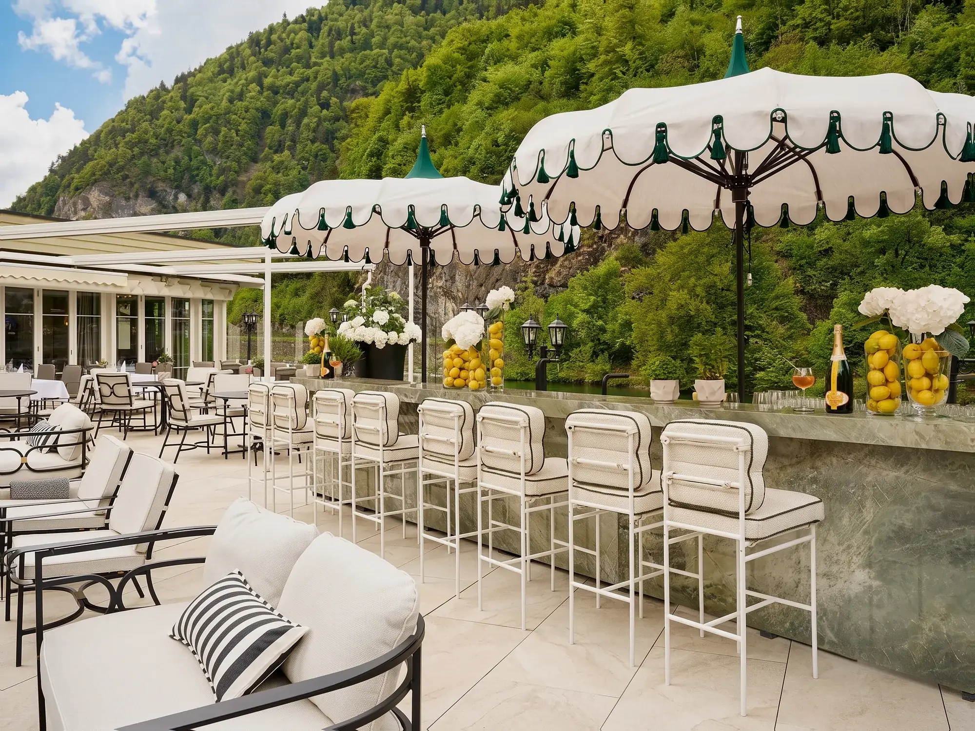 Striped parasols on the terrace «La Belle Rivière»